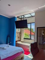 Ceria House Ungasan Uluwatu客房内的一张或多张床位