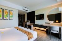 Big Dragon Villas Ubud客房内的一张或多张床位