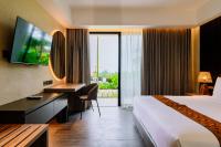 Big Dragon Villas Ubud客房内的一张或多张床位