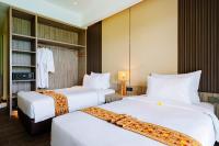 Big Dragon Villas Ubud客房内的一张或多张床位