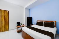 Super Hotel O RUBY GRAND INN客房内的一张或多张床位