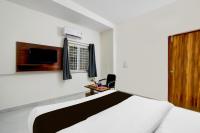 Super Hotel O RUBY GRAND INN客房内的一张或多张床位