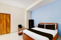 Super Hotel O RUBY GRAND INN客房内的一张或多张床位