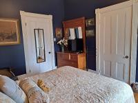 Gîte au Charme Victorien客房内的一张或多张床位