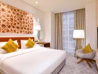 Grand Mercure Dubai City客房内的一张或多张床位
