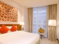 Grand Mercure Dubai City客房内的一张或多张床位