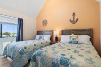 Ocean&#39;s Bliss at Arcadian Dunes客房内的一张或多张床位