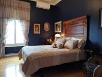 Gîte au Charme Victorien客房内的一张或多张床位