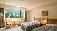 Tateyama Kokusai Hotel客房内的一张或多张床位