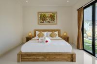 Luxury Nanda villa Ubud客房内的一张或多张床位