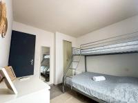 Maison vacances proche de la mer客房内的一张或多张床位