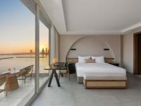 Rixos The Palm Hotel &amp; Suites - Ultra All Inclusive客房内的一张或多张床位