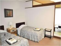 Tateyama Kokusai Hotel客房内的一张或多张床位