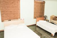 Cumbipar King Hotel客房内的一张或多张床位