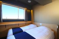 浅草驹形WING国际酒店 客房内的一张或多张床位
