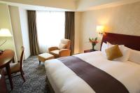 International Resort Hotel Yurakujo客房内的一张或多张床位