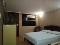 Cumbipar King Hotel客房内的一张或多张床位