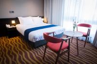 Gloucester Hotel Jeju客房内的一张或多张床位