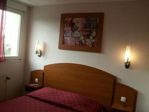 Enzo Hotels Bulgneville by Kyriad Direct客房内的一张或多张床位