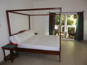 Sarawally Guesthouse客房内的一张或多张床位