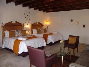 Hotel Casa Don Quijote客房内的一张或多张床位