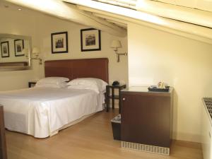 圣奇阿拉酒店客房内的一张或多张床位
