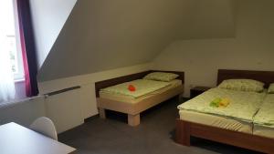 Hotel & Hostel Marenberg Radlje客房内的一张或多张床位