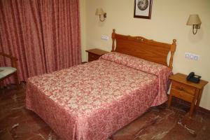 Hotel Albohera客房内的一张或多张床位
