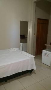 Hotel Boiadeiro客房内的一张或多张床位