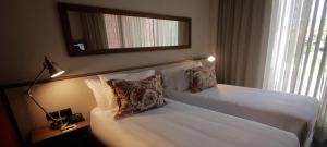 波托布西奥酒店客房内的一张或多张床位