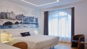 Boulevart Donostia客房内的一张或多张床位