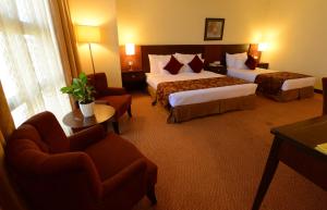 The Grand Puteri Hotel客房内的一张或多张床位
