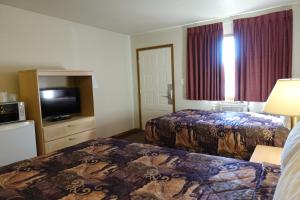 Armada Inn Motel客房内的一张或多张床位