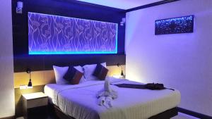 
Patong Mansion - SHA Certified客房内的一张或多张床位
