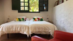 Finca Hoya del Pozo客房内的一张或多张床位