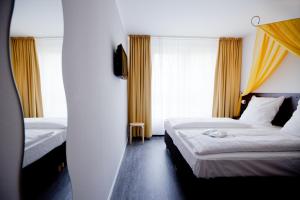 柏林基兹潘森酒店客房内的一张或多张床位