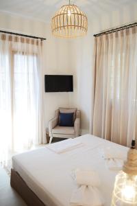 Kelly Hotel Agios Ioannis Pelion客房内的一张或多张床位