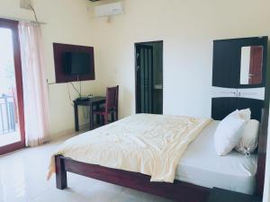 德思德考斯特巴厘岛民宿客房内的一张或多张床位