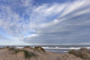 奥利瓦Comtessa的一片多沙的海滩,天空和大海