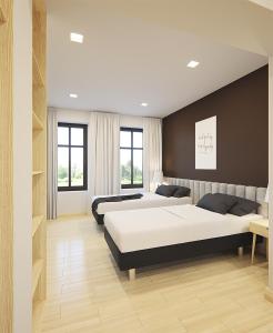 莱格尼察SleepWell Apartments的一间带两张床和一张沙发的卧室