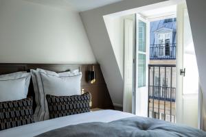 Hôtel La Tamise - Esprit de France客房内的一张或多张床位