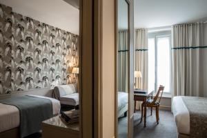 Hôtel Parc Saint-Séverin - Esprit de France客房内的一张或多张床位