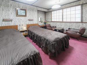 昭荣河滨日式旅馆客房内的一张或多张床位