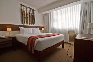 蒂拉维瓦普诺广场酒店客房内的一张或多张床位