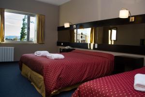 卡拉法特马可波罗套房酒店客房内的一张或多张床位