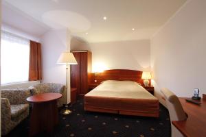 普罗伊斯达姆图帕莱斯酒店客房内的一张或多张床位