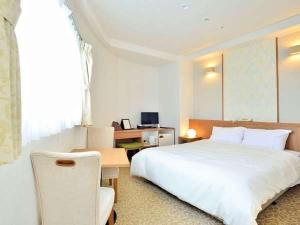 小豆岛海湾度假酒店客房内的一张或多张床位