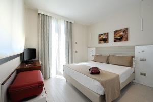 卡瓦露西奥圣马力诺住宅酒店客房内的一张或多张床位