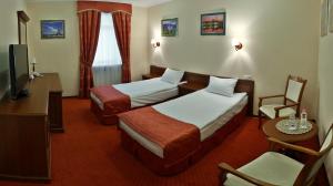 乌克兰罗夫诺酒店 客房内的一张或多张床位