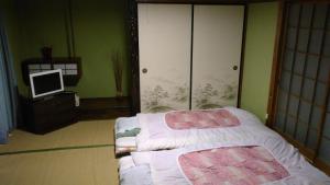 高梁卡施布奈藤传统日式民宿客房内的一张或多张床位